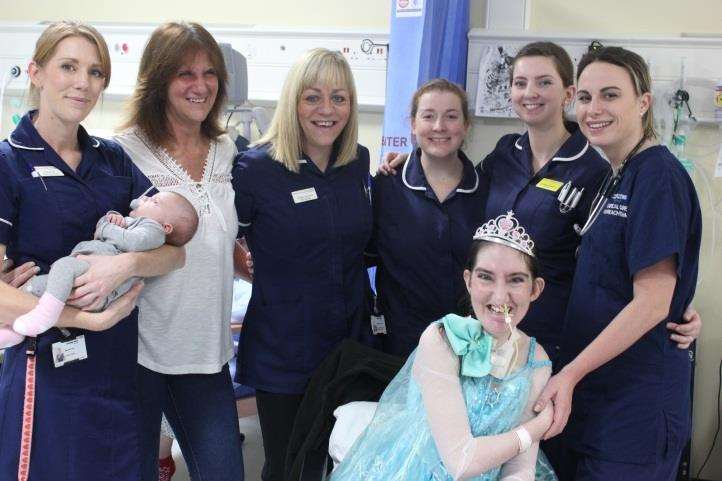 Chelsea Kirby, 26, with staff from Maidstone Hospital before she was discharged