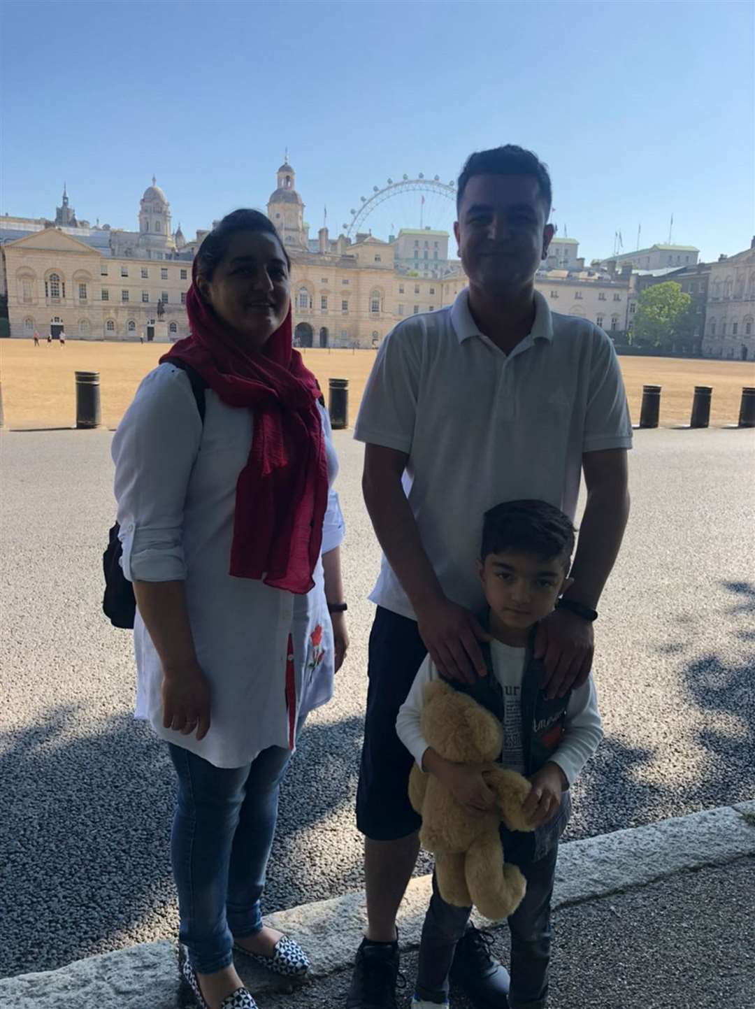 Burhan Vesal with his wife and son (Burhan Vesal/PA)