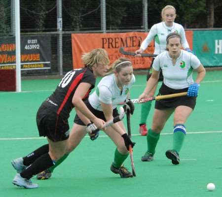 Canterbury Ladies (White) come away with the ball against Bowdon Hightown