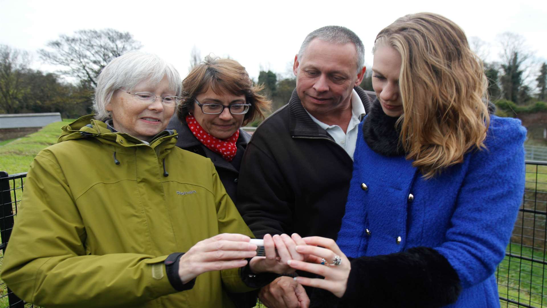 Nina Robinson, Nicola Moy and Martin Rogers show Clare Freeman the app. Picture: Darren Small.