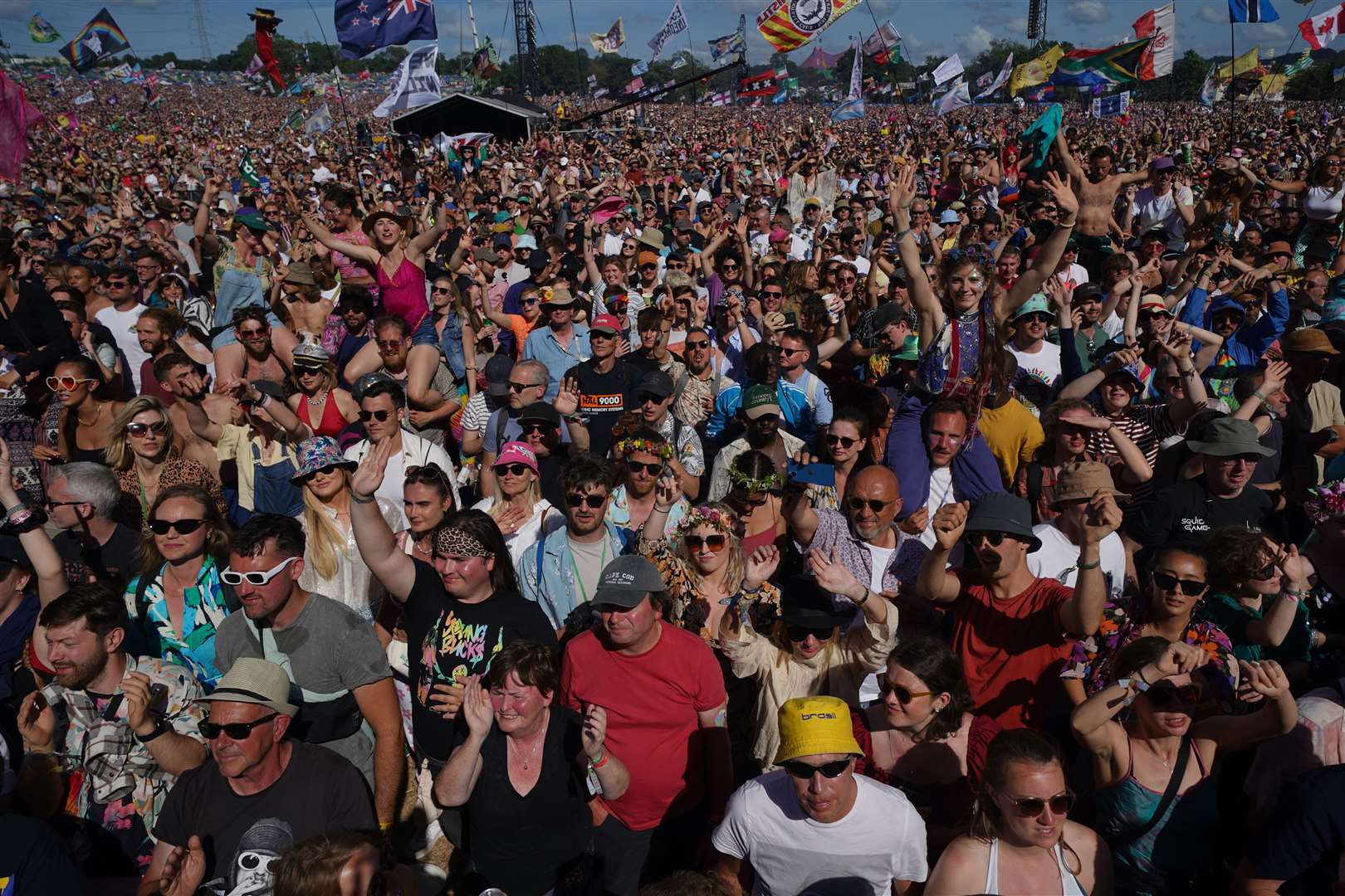 The buoyant crowd watches Ross perform (Yui Mok/PA)