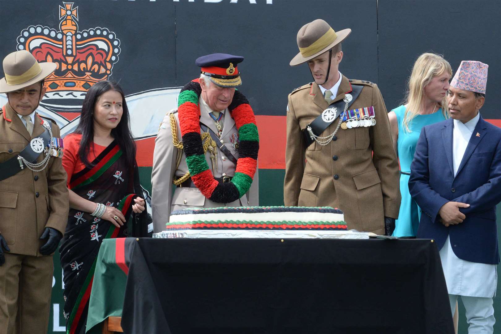 The Prince cuts the 25th anniversary cake. Picture: Chris Davey