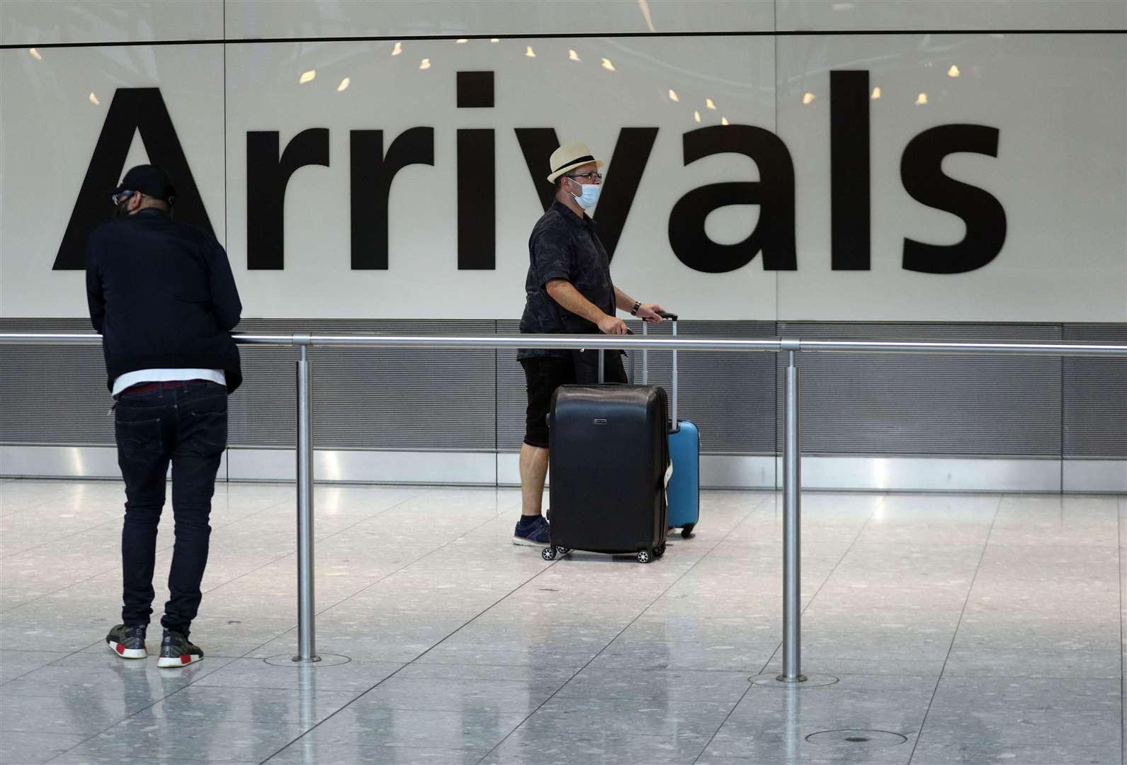 Passengers at Heathrow after people returning from Spain were told they must quarantine when they return home (Steve Parsons/PA)