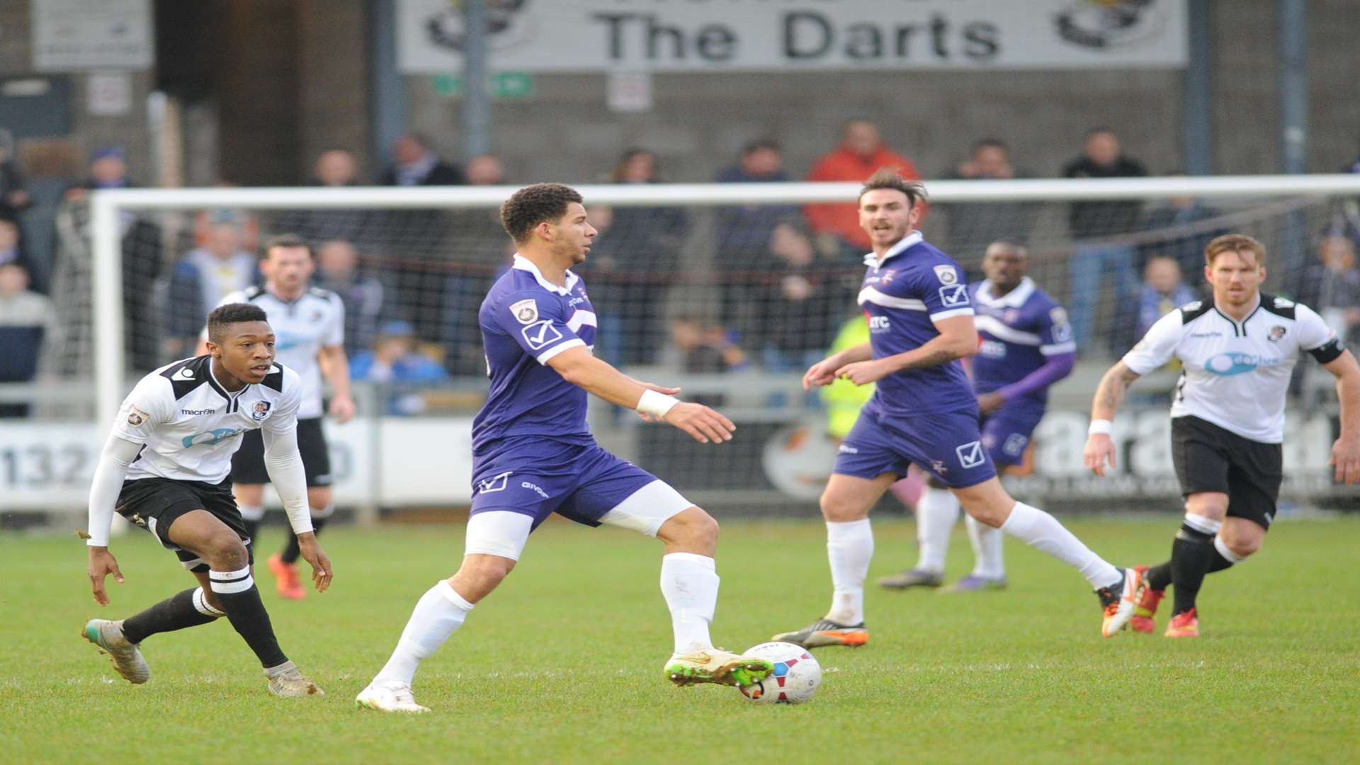 Nathan Green on the ball in midfield watched by Ebou Adams Picture: Steve Crispe