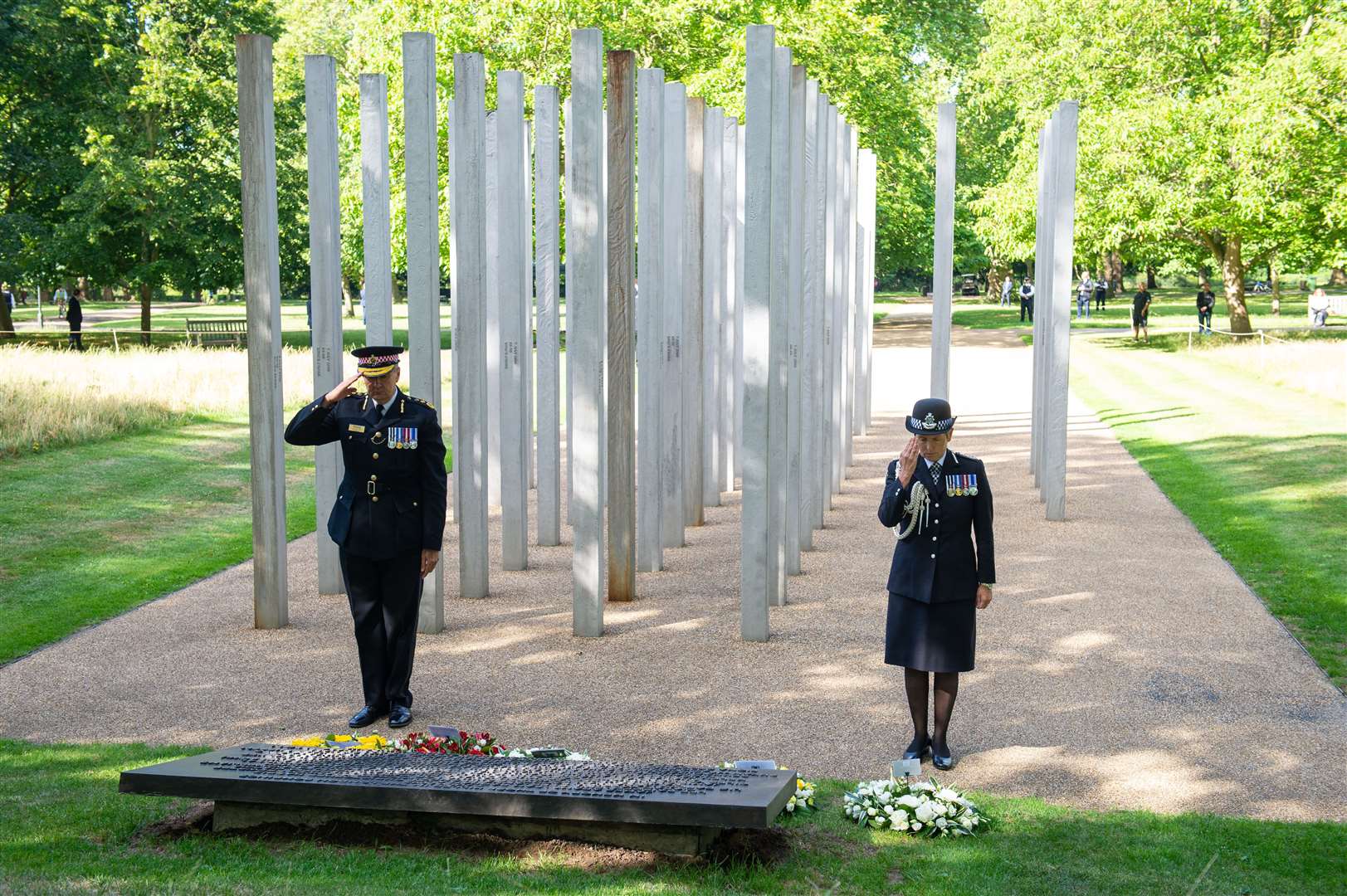 City of London Police Commissioner Ian Dyson and Metropolitan Police Commissioner Cressida Dick lay wreaths at the London Bombing Memorial in Hyde Park (Dominic Lipinski/PA)