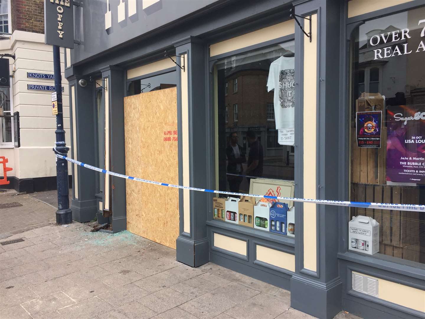 The shop doors were boarded up by police