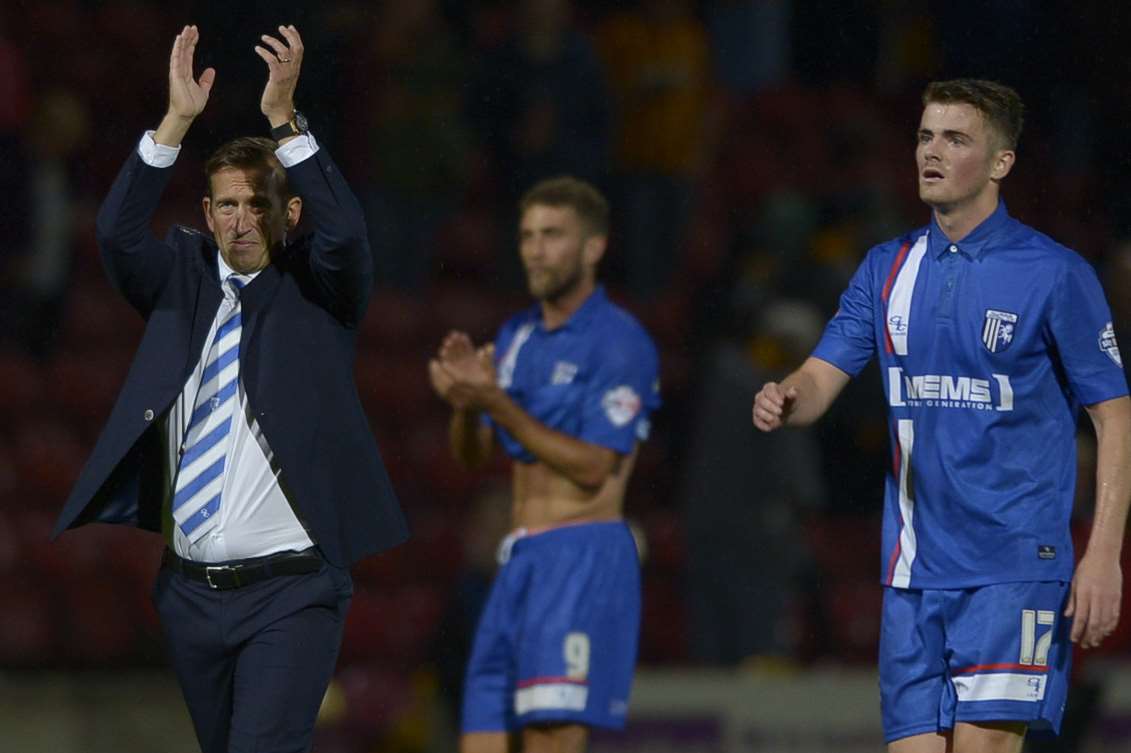 Gills boss Justin Edinburgh salutes the travelling fans at Bradford Picture: Barry Goodwin