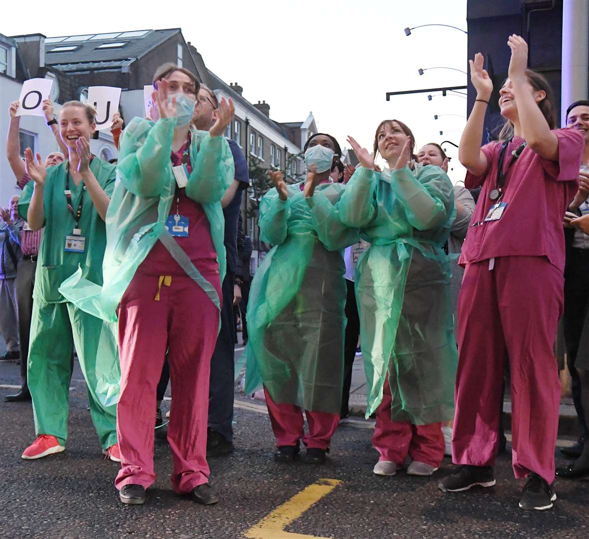 Staff from the Chelsea and Westminster Hospital in London respond to rousing applause (Kirsty O’Connor/PA)