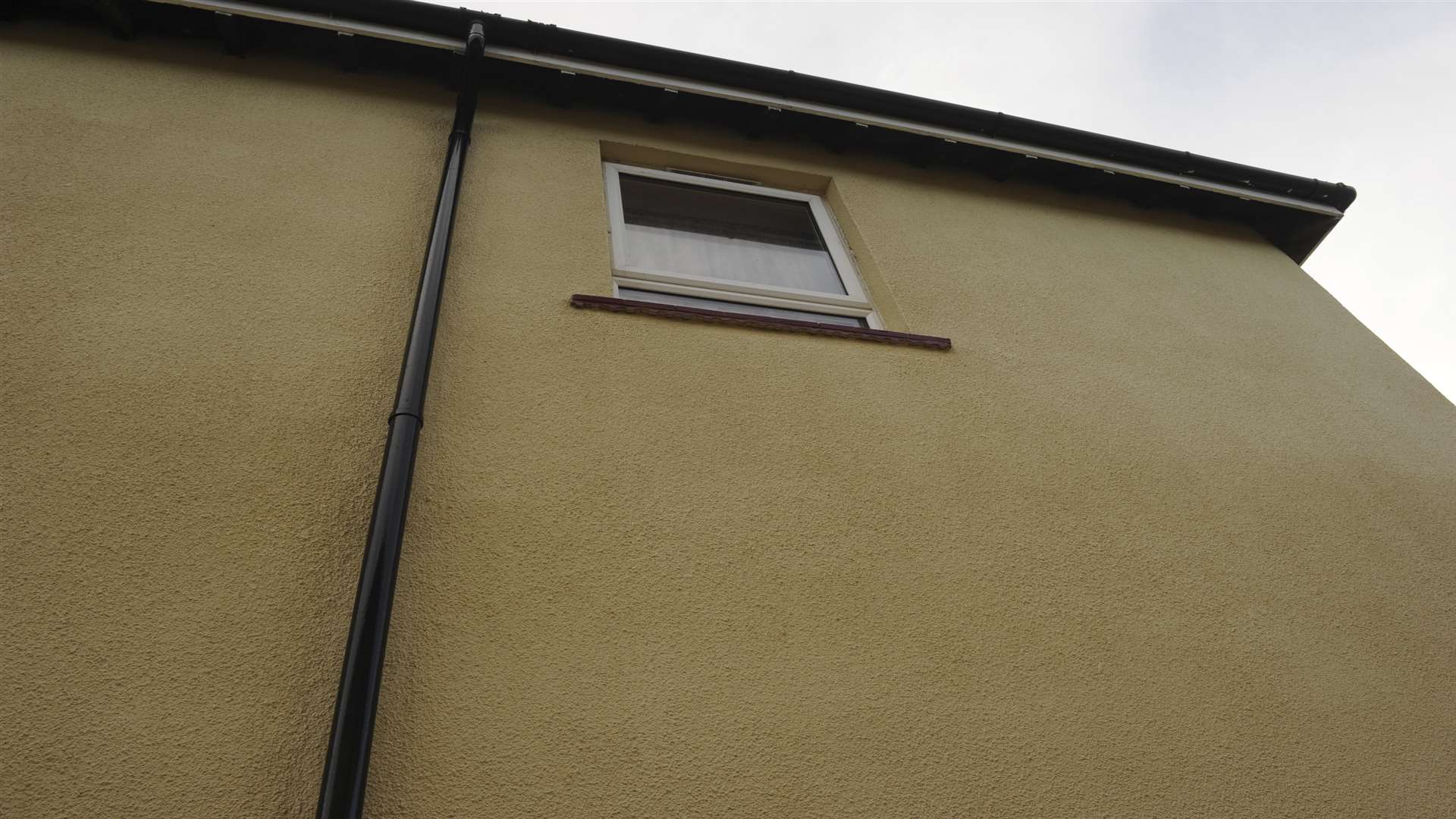 The bedroom window overlooks the neighbouring home's back garden