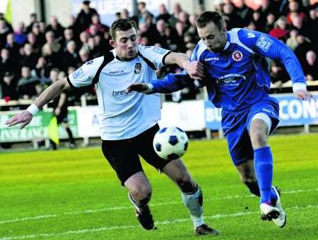 Dartford's Ryan Hayes battles with Welling full-back Jack Obersteller.