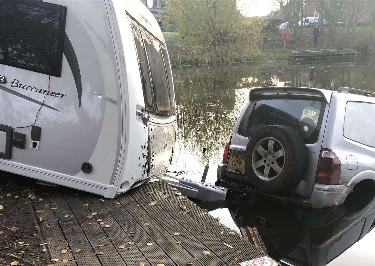 A 4X4 towing a caravan ended up in the lake off Newman Drive, Kemsley. Picture: James Spoerry