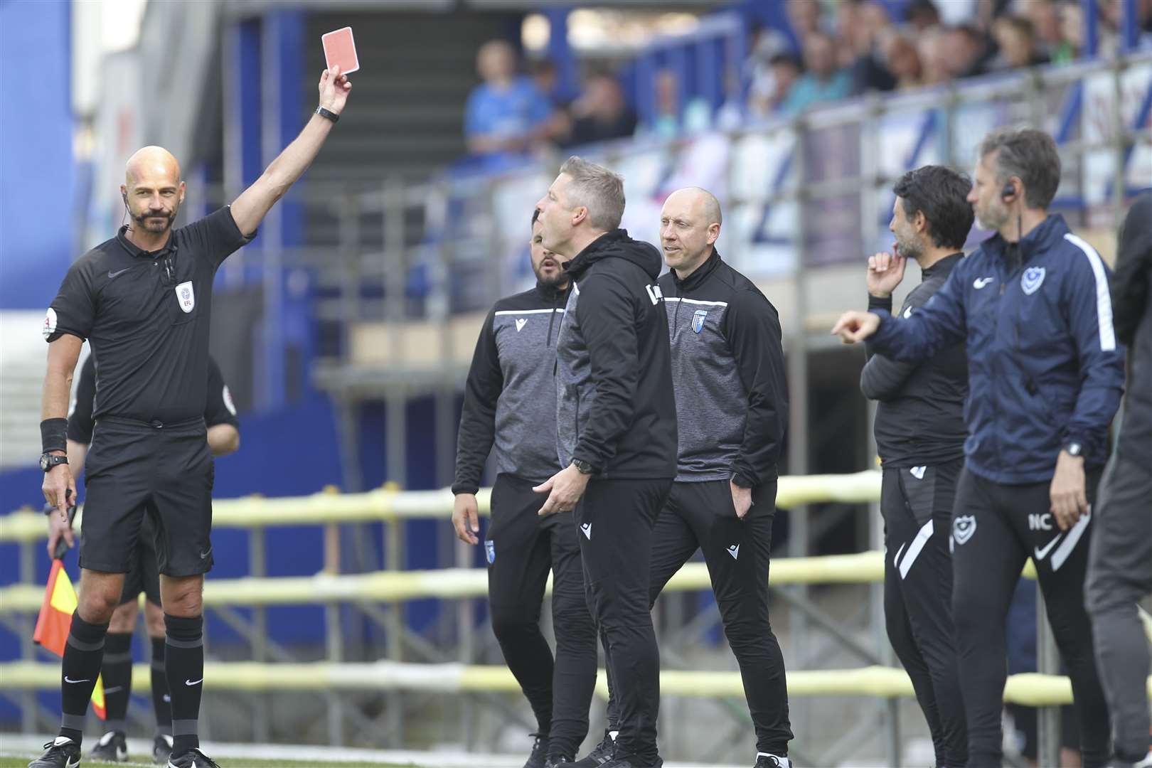 Neil Harris is shown a red card after questioning referee Darren Drysdale Picture: KPI