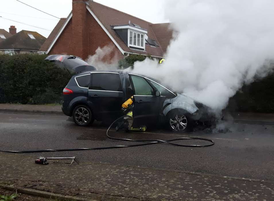 Firefighters tackled the car blaze