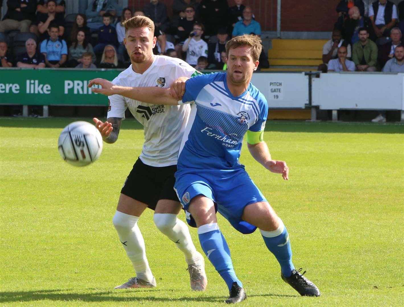 Sonny Miles holds off Jack Jebb of Dartford. Picture: David Couldridge