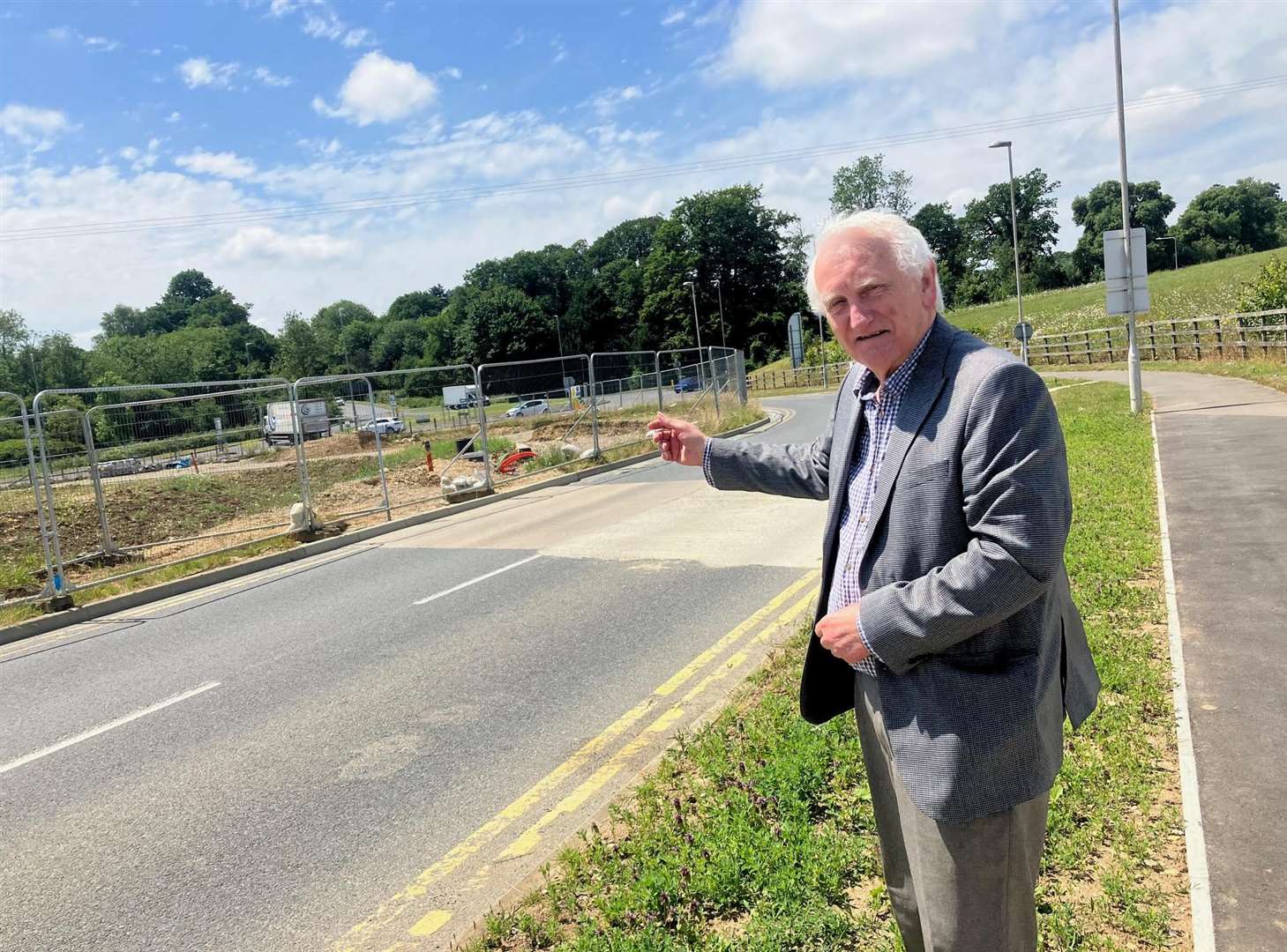 Cllr Denis Spooner at the A249 roundabout at Grove Green, near Maidstone, where KCC has shelved work. Picture: Simon Finlay