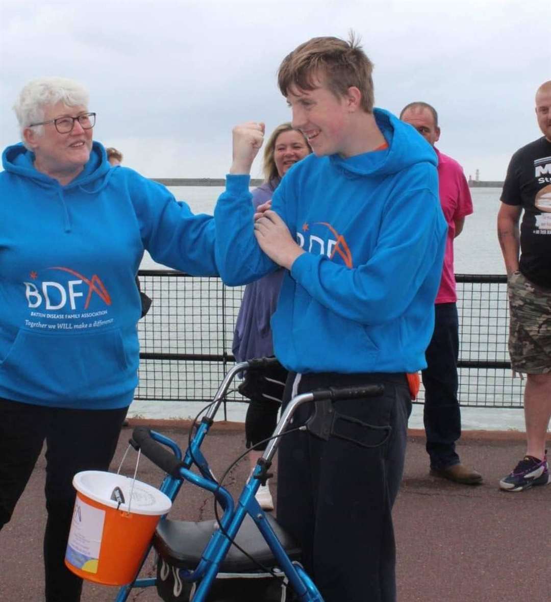 A delighted Ryan, 14, celebrates completing his 50-mile challenge in aid of BDFA