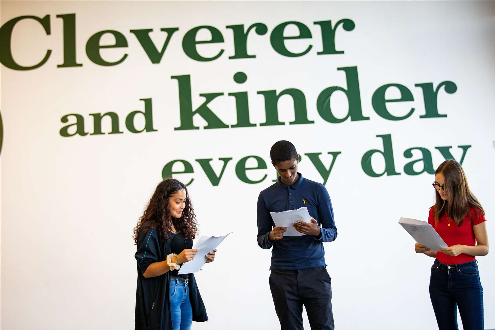 (left to right) Students Brenda Cinotti, Joshua Fessahaye and Adriana Fernandes Martins look at their GCSE results at Ark Evelyn Grace Academy (Aaron Chown/PA)