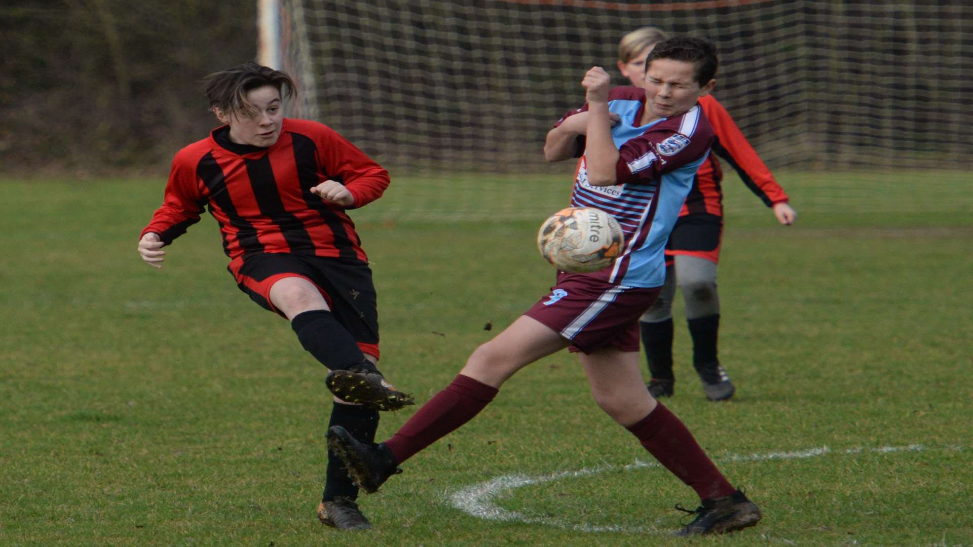 Meopham Colts under-13s and Wigmore Youth get stuck in Picture: Chris Davey