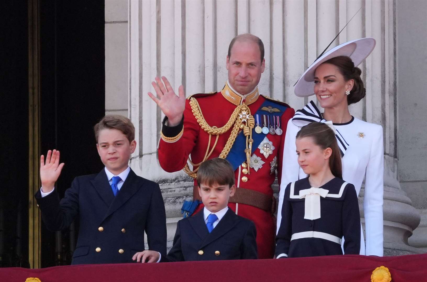 The Prince and Princess of Wales with their children, Prince George, Prince Louis, and Princess Charlotte on the balcony of Buckingham Palace in June (Gareth Fuller/PA)