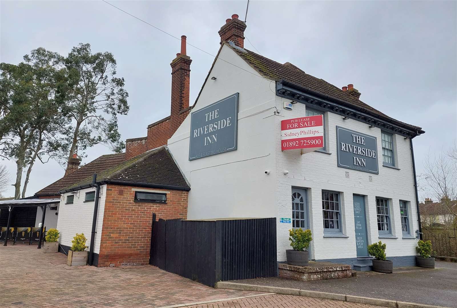 The Riverside Inn sits next to the East Stour river