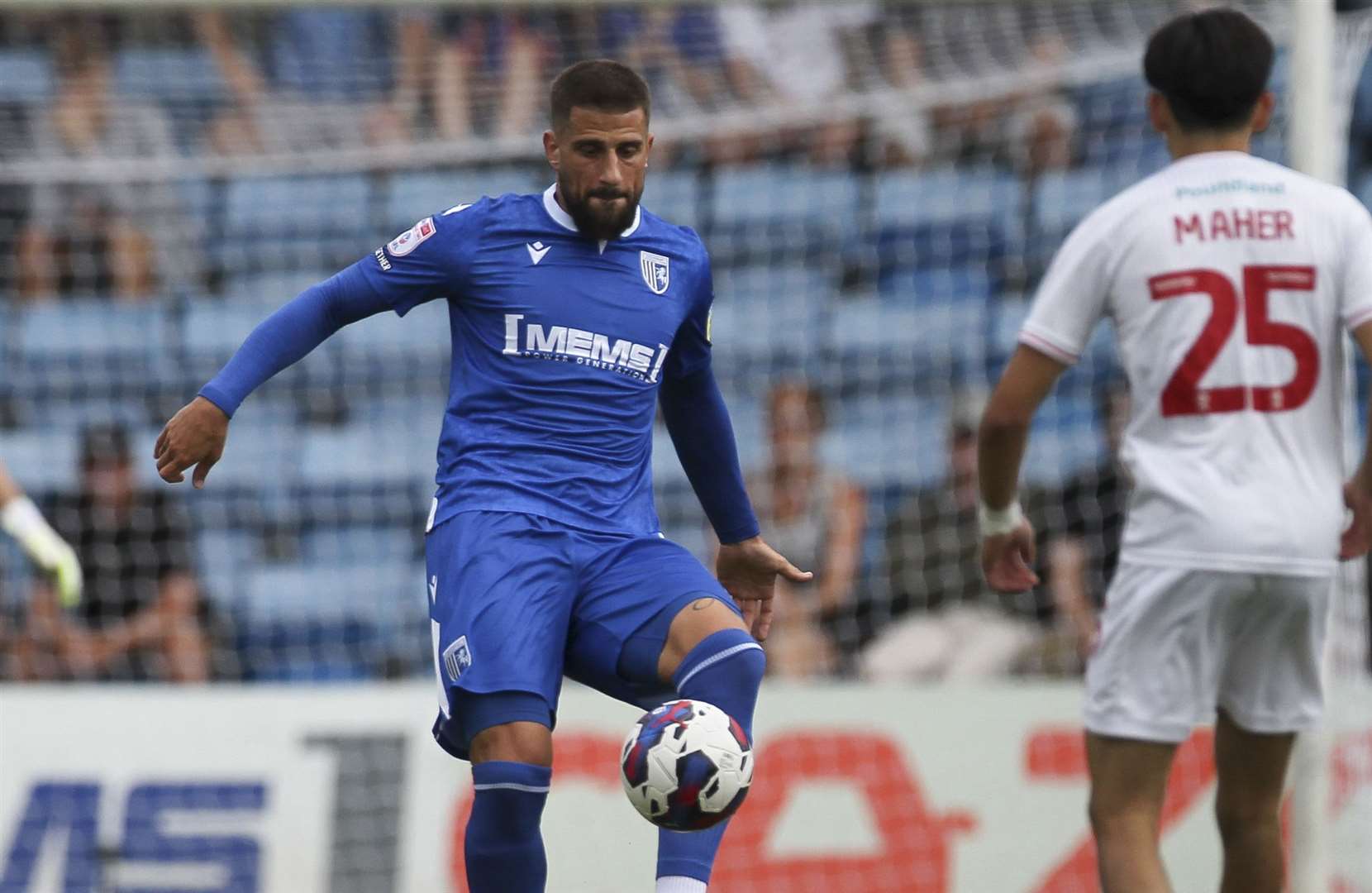 Gillingham defender Max Ehmer sends the ball forward. Picture: KPI