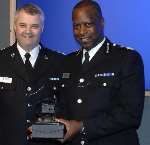 Chief Constable Mike Fuller receives a respect award from Chief Insp Mark Harrison