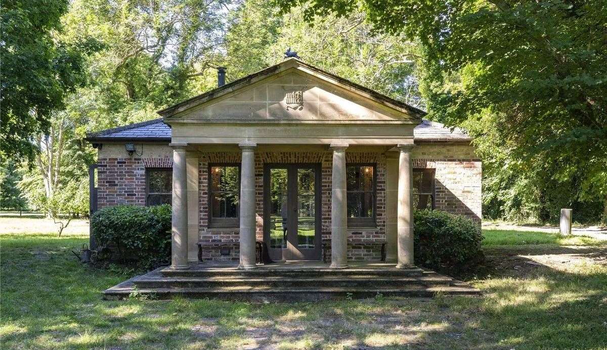 The classically styled summer house overlooks the picturesque gardens. Picture: Savills