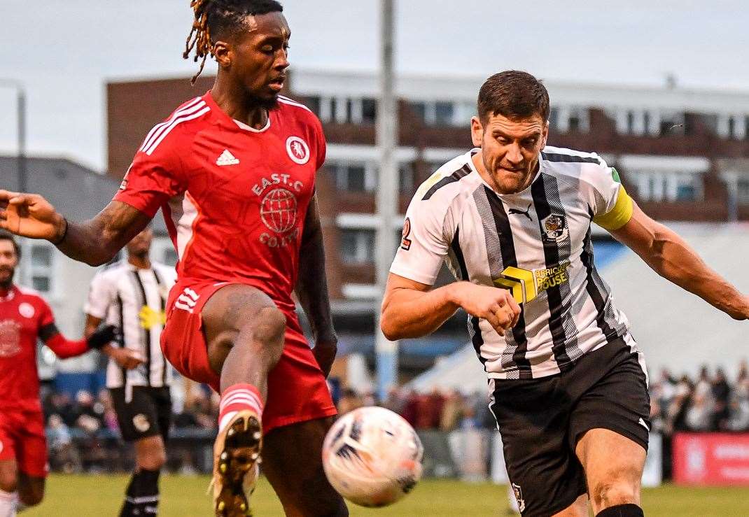 Tom Bonner up against Welling striker Ade Azeez. Picture: Dave Budden