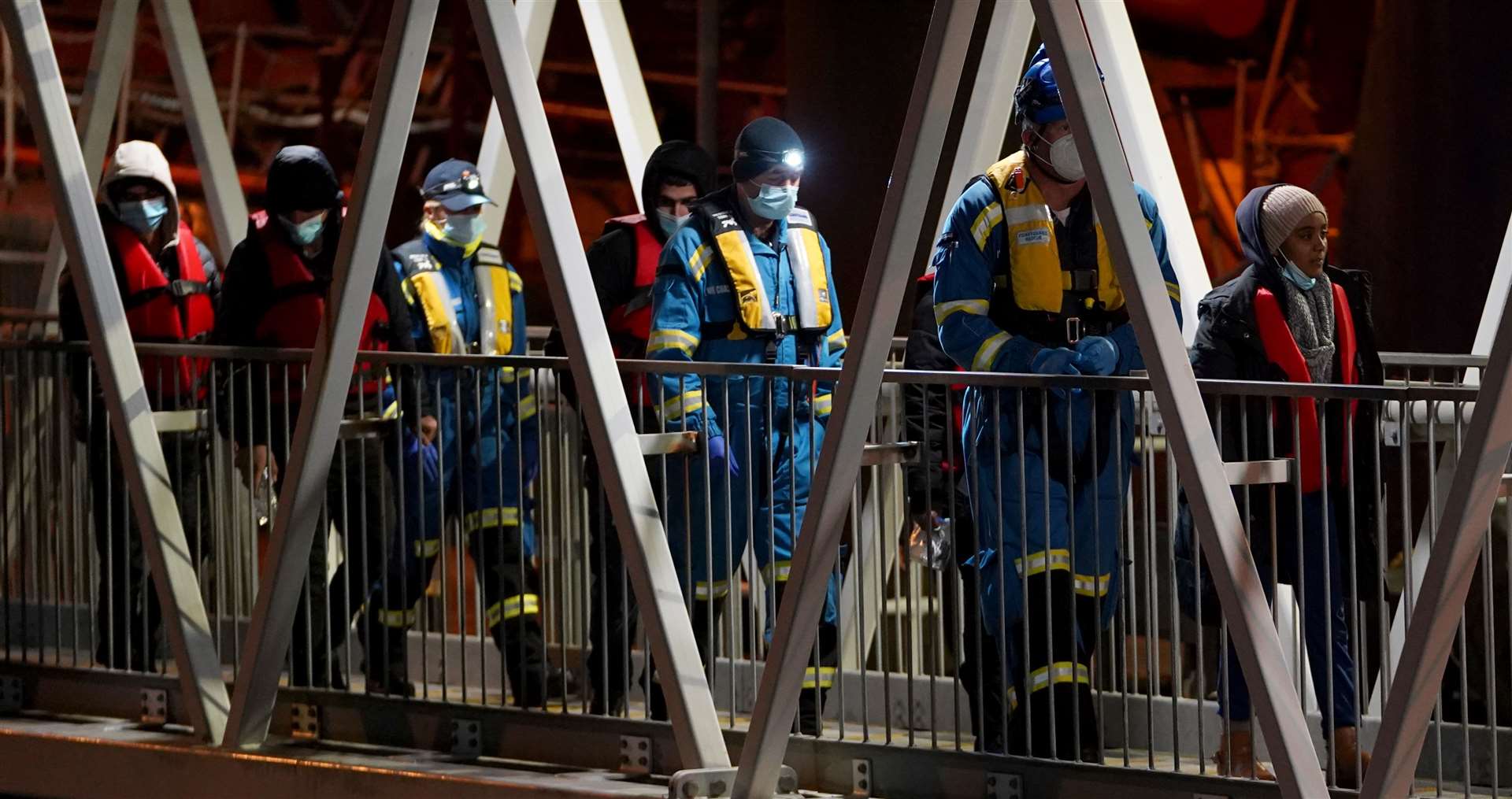 A group of people thought to be migrants are brought in to Dover, Kent, by Coastguard officers (Gareth Fuller/PA)