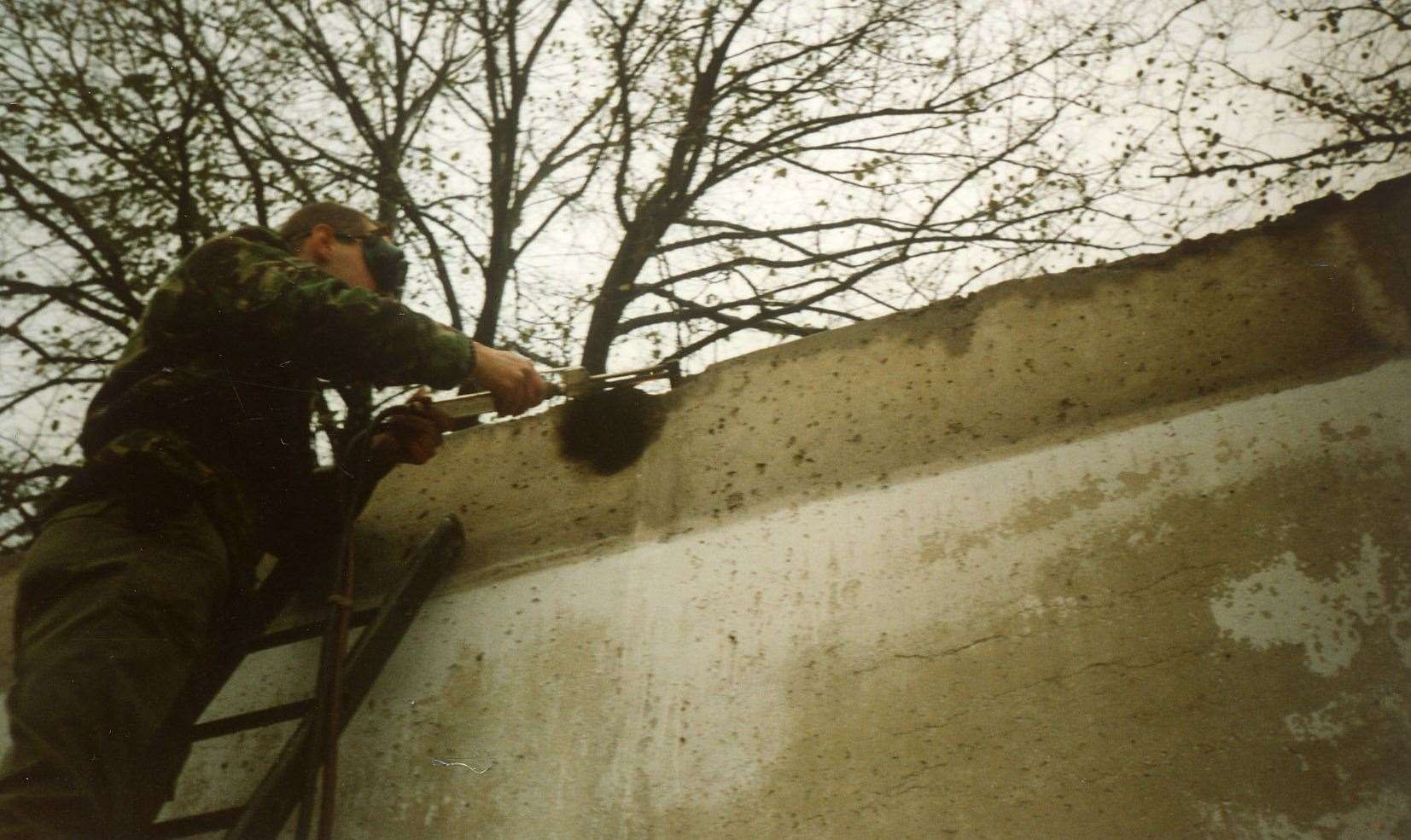 Sapper Jason Farnell at work on the Berlin Wall