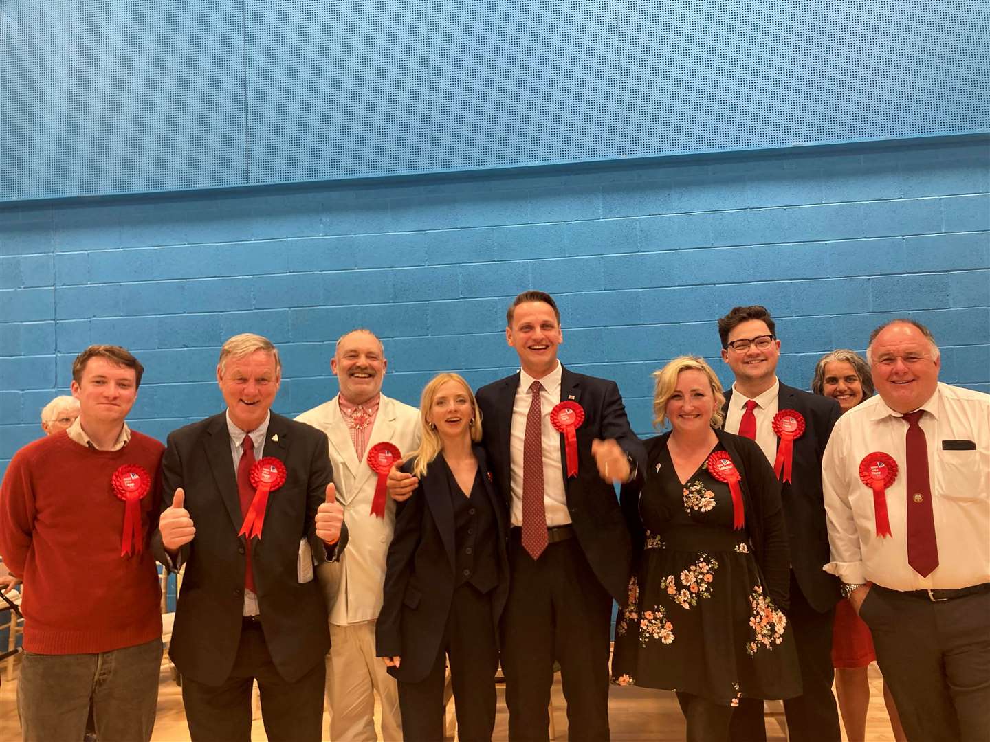 Labour's Mike Tapp (centre) and his campaign team celebrating their victory on July 4