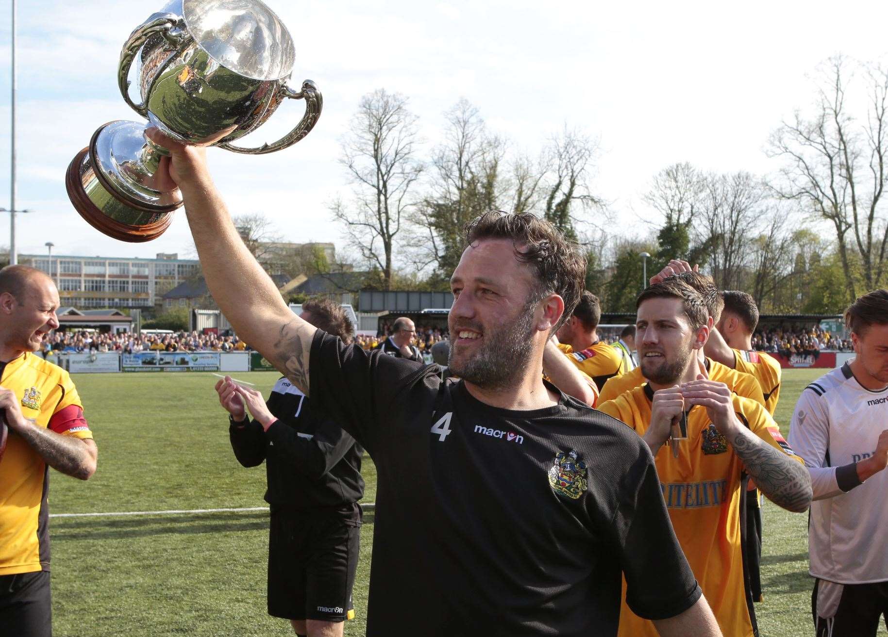 Happier times for Jay Saunders as he celebrates leading Maidstone to the 2014/15 Ryman League Premier Division title Picture: Martin Apps
