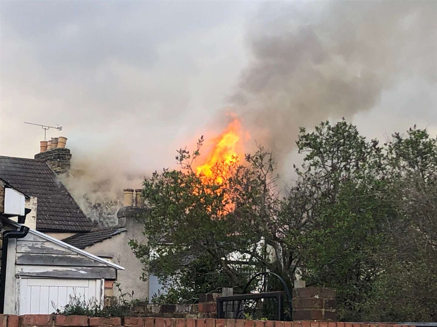 Flames in the roof of a derelict house in Skinner Street, Gillingham, on Monday evening