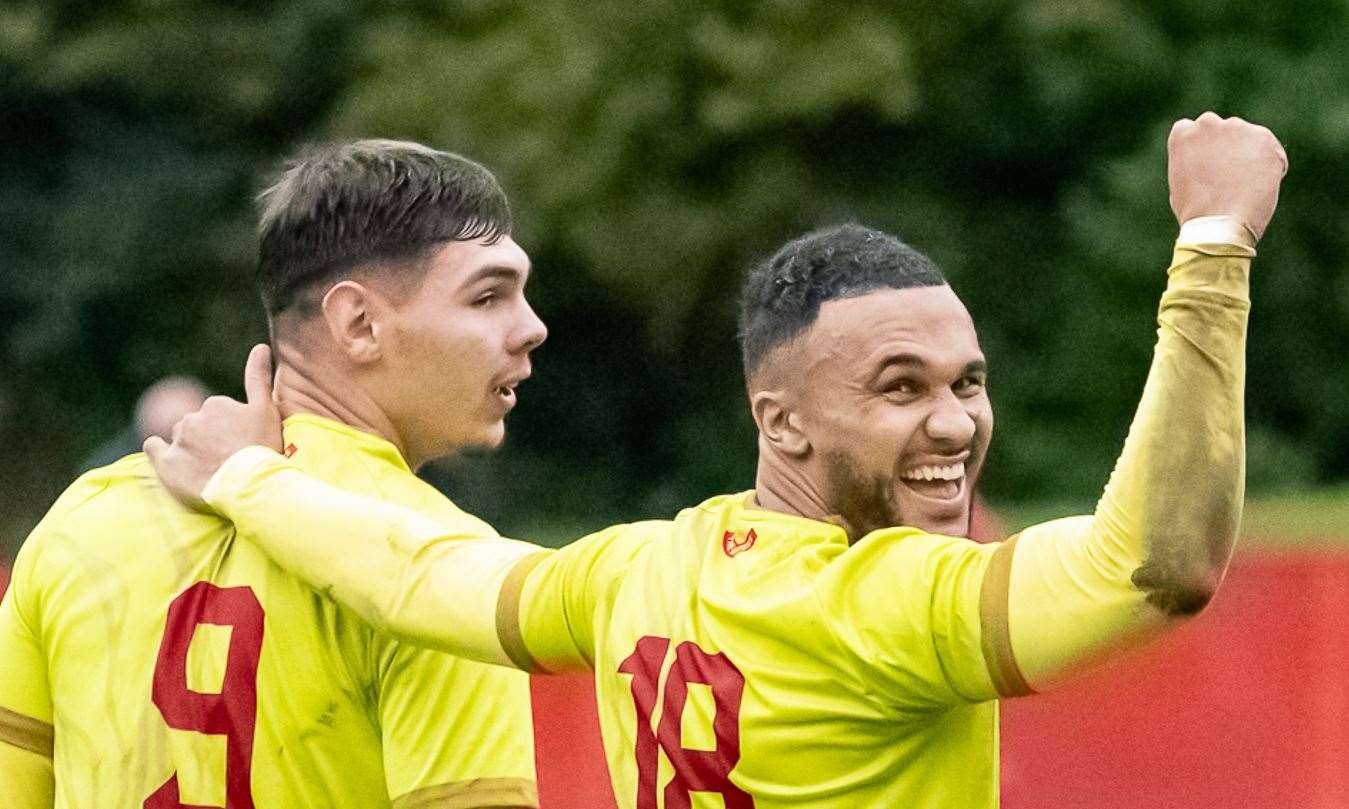 Whitstable players Harvey Smith and Dean Grant are happy with Josh Oliver's goal. Picture: Les Biggs