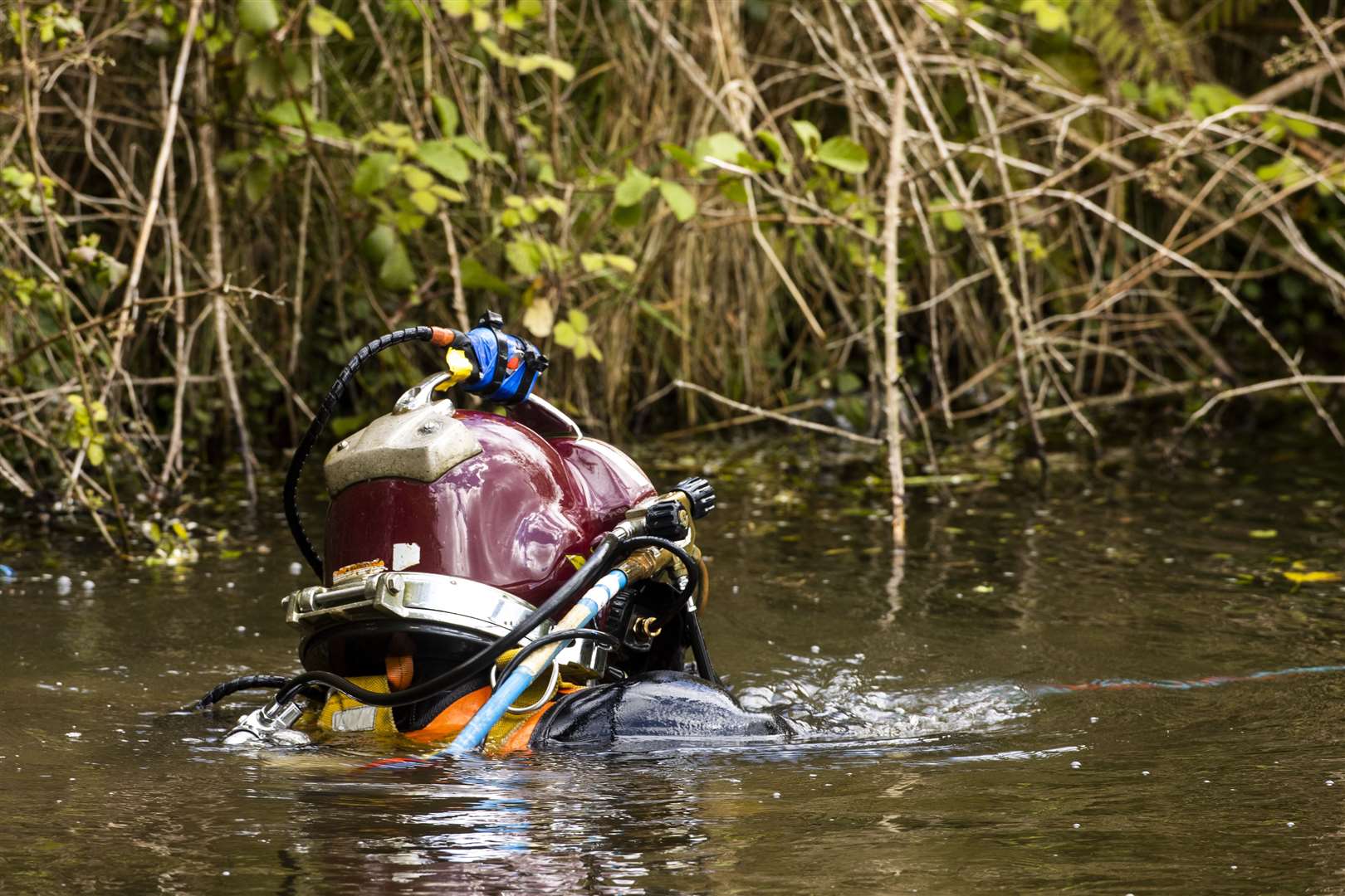 A diver in the water at the Clay Pits, Ballyhalbert, in the search for Lisa Dorrian (Liam McBurney/PA)