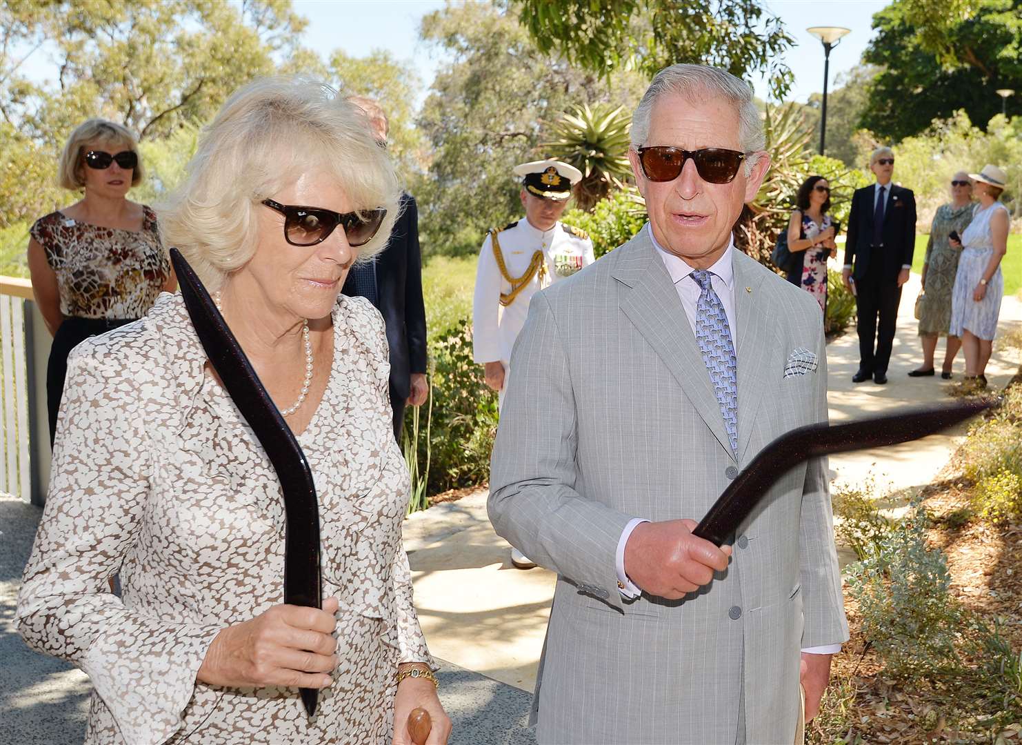 The then-Prince of Wales and Duchess of Cornwall holding their boomerangs in 2015 (John Stillwell/PA)