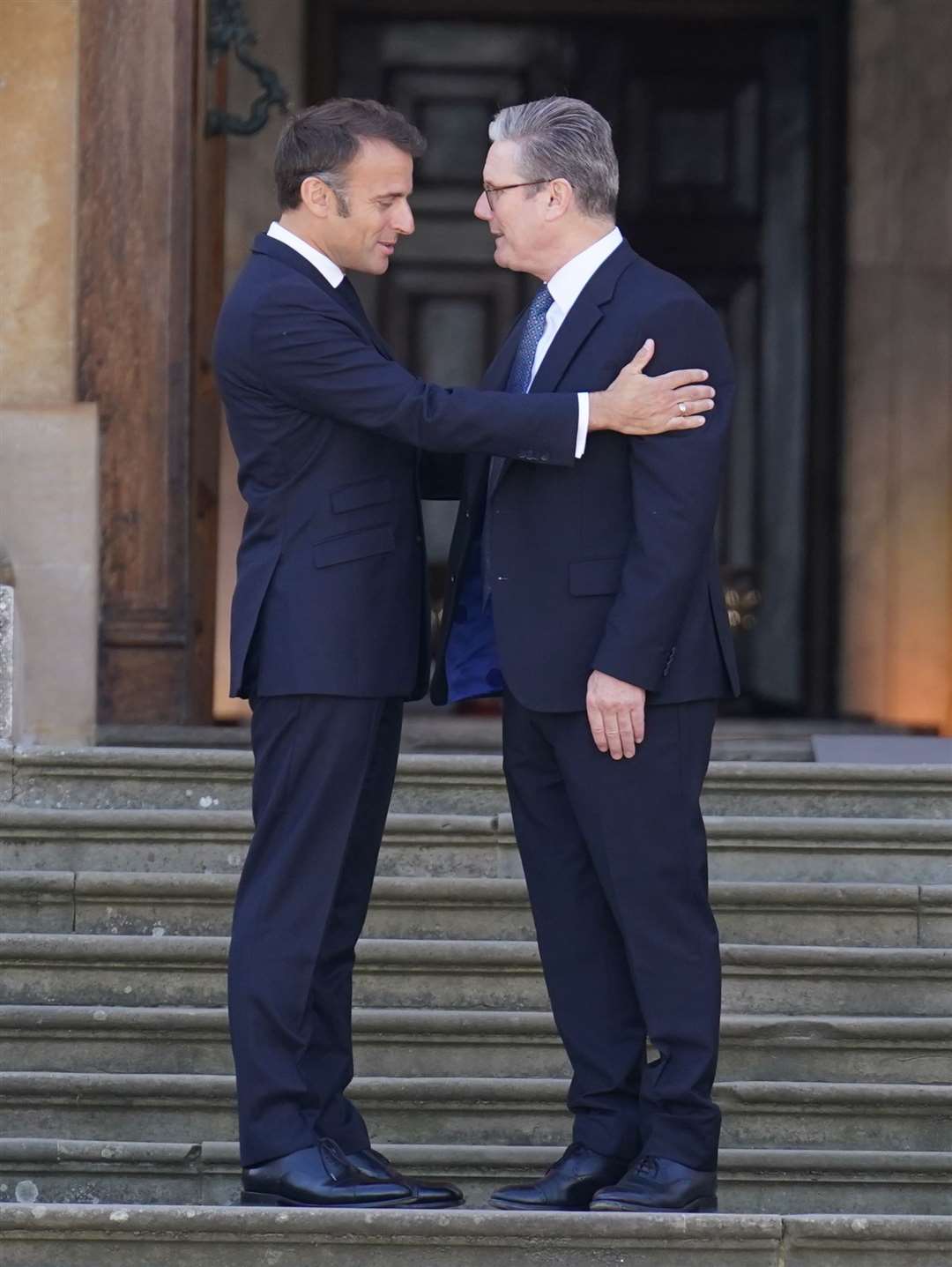 President of France Emmanuel Macron is welcomed by Prime Minister Sir Keir Starmer to the European Political Community summit at Blenheim Palace (Stefan Rousseau/PA)