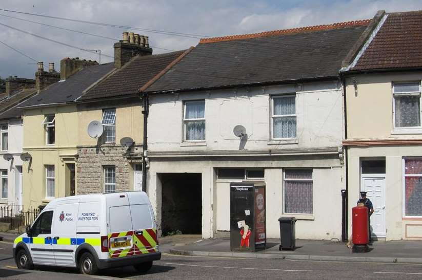 Police outside the flat in Dover where the body was found