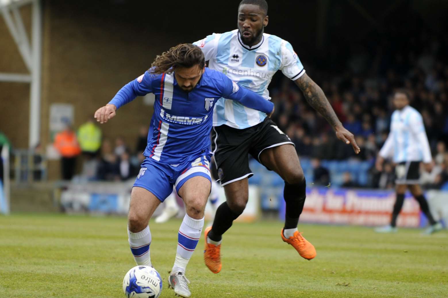 Bradley Dack holds off a Shrewsbury challenge