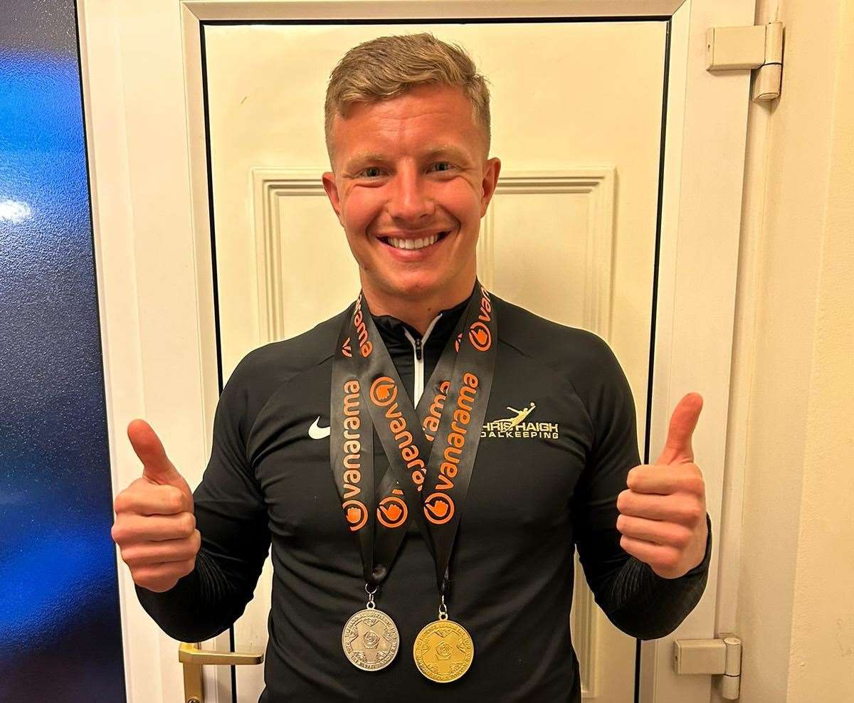 Ebbsfleet keeper Chris Haigh with his two medals - a National League South title and play-off winner in one season