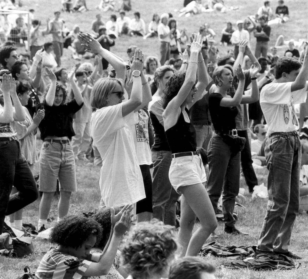 Revellers at an open-air rock concert held at Broome Park, Canterbury, in May 1991. Danni Minogue, Gerry Marsden (from Gerry and the Pacemakers) and Sinitta were among those performing