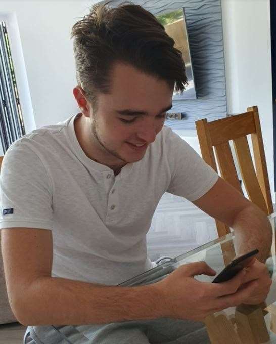 Sittingbourne School A-level pupil Callum Humphrey getting his results online