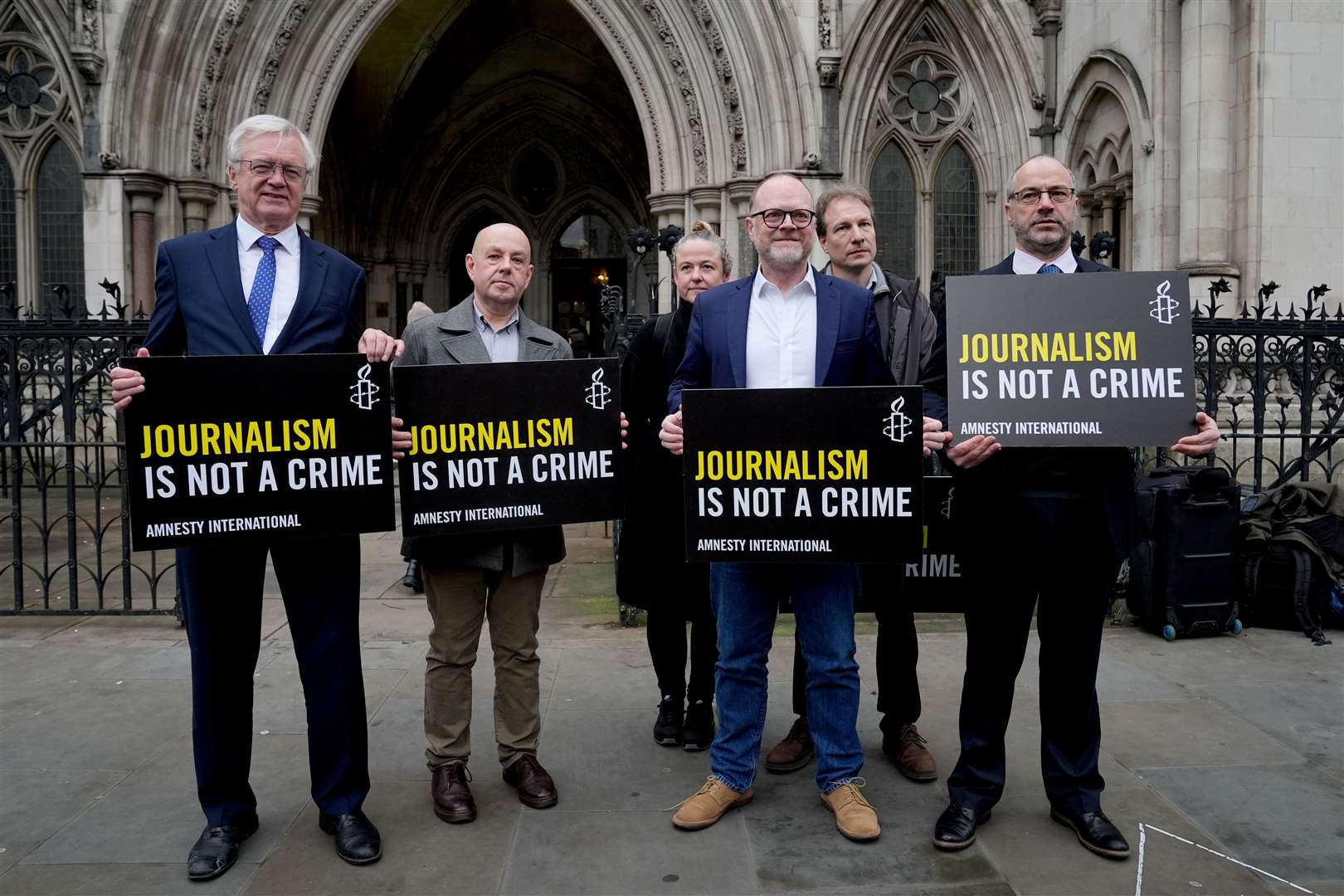 Journalists Barry McCaffrey and Trevor Birney with Conservative MP Sir David Davis (Lucy North/PA).