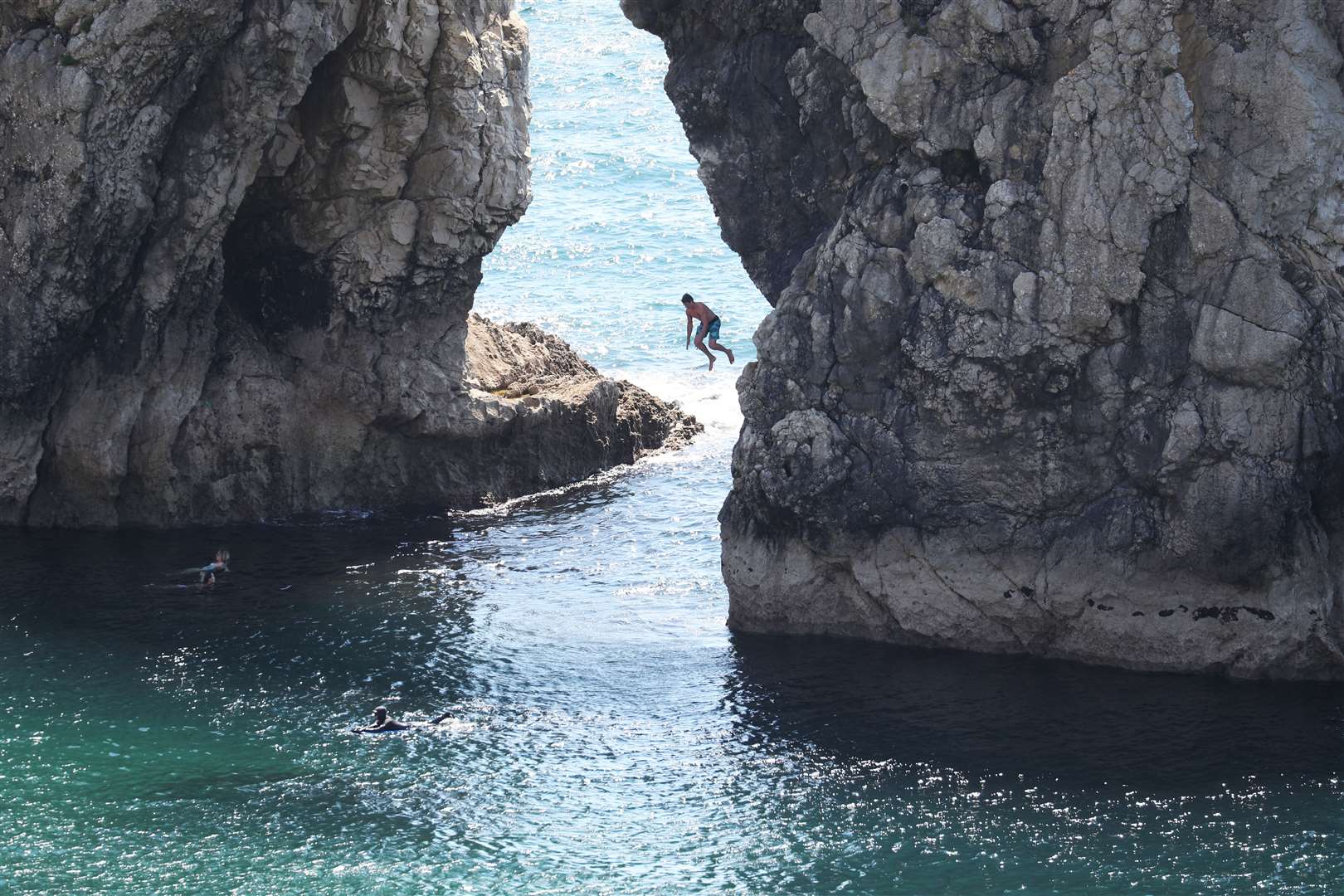 A person jumping into the sea on Sunday (Andrew Matthews/PA)