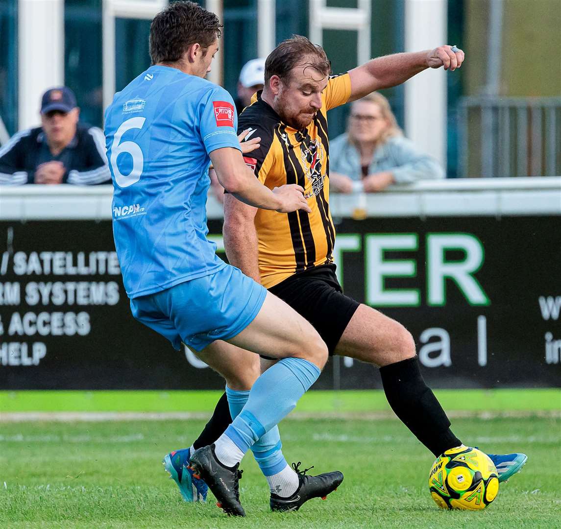 Folkestone midfielder Sam Blackman is closely marked during last Tuesday’s 2-1 home friendly defeat to Deal. Picture: Helen Cooper