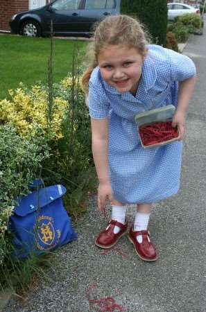 Thalia Duffy, six, retrieving rubber bands discarded and causing her concerns