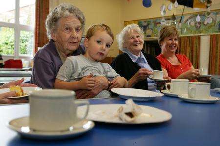 Dorothy Howland and Tom Edwards enjoy a cuppa at Macmillan's World's Biggest Coffee Morning fundraiser at Egerton School in 2010