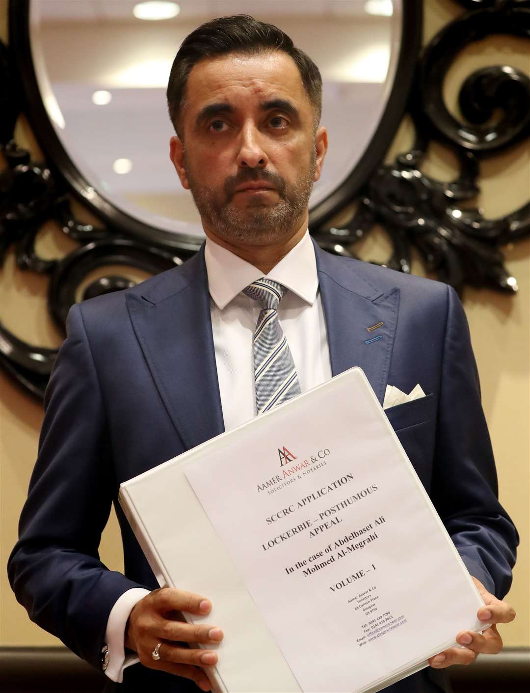 Lawyer Aamer Anwar with documents relating to the appeal (Andrew Milligan/PA)