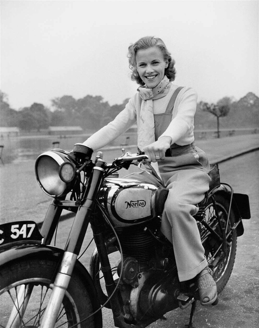 Blackman pictured riding her Norton Big Four motorcycle through Hyde Park in London at age 23 in 1949 (PA)