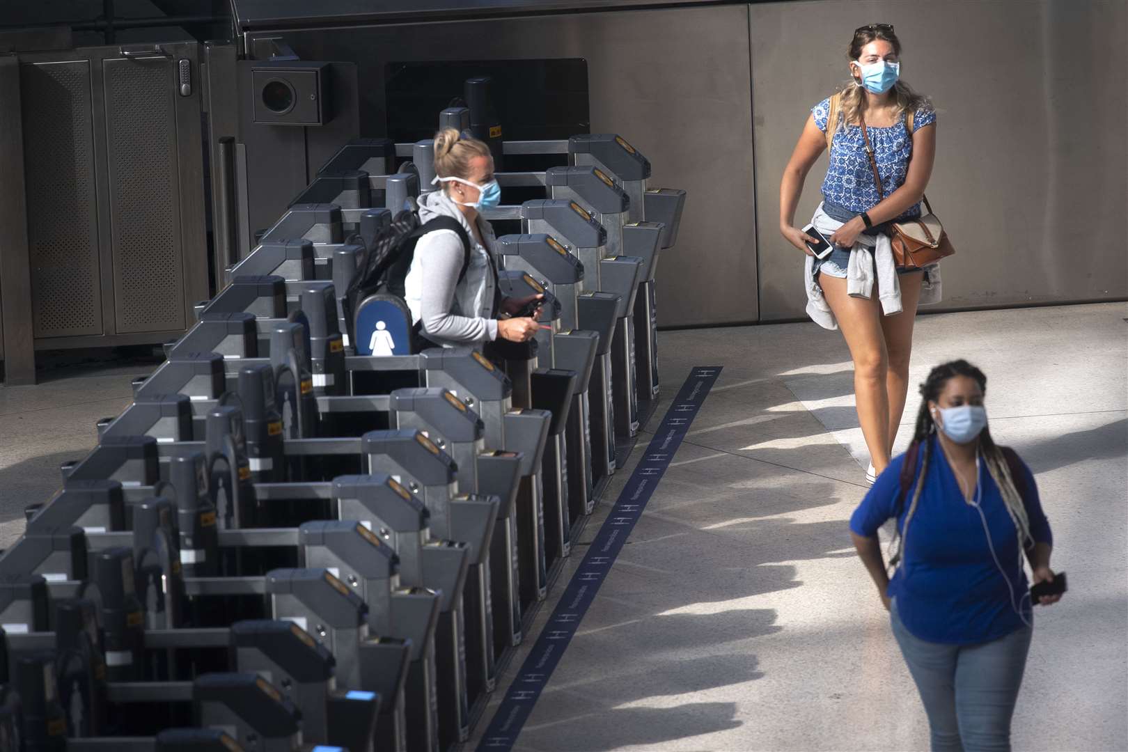 Passengers wearing face masks at Waterloo station in London (Victoria Jones/PA)